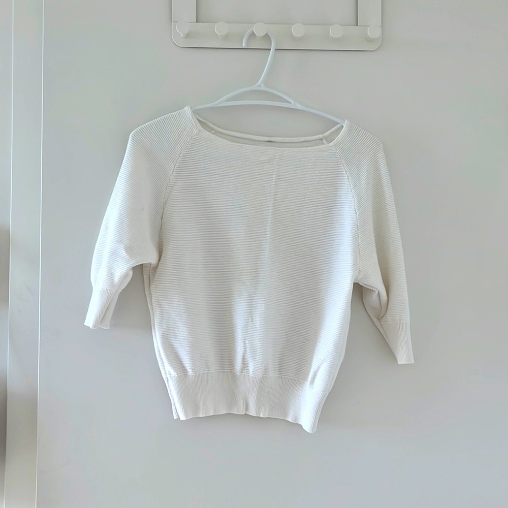 White top with mid length sleeves